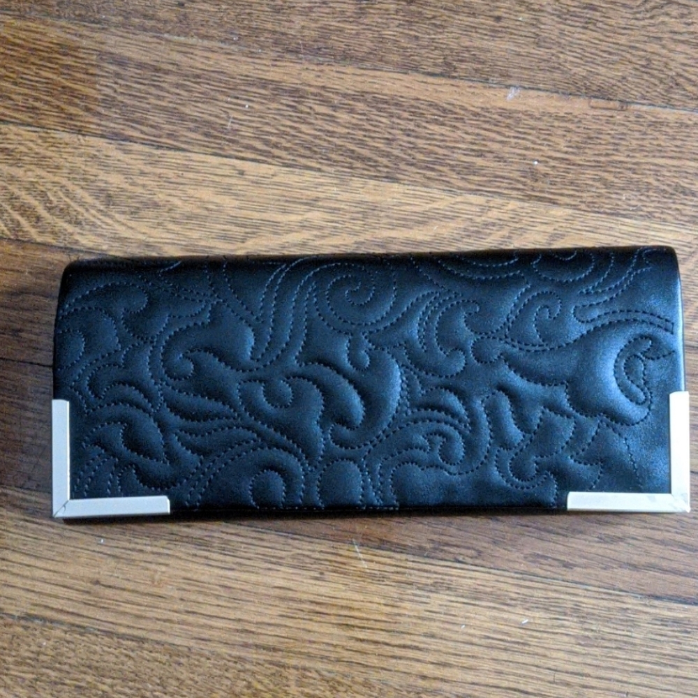 Black clutch with gold accents